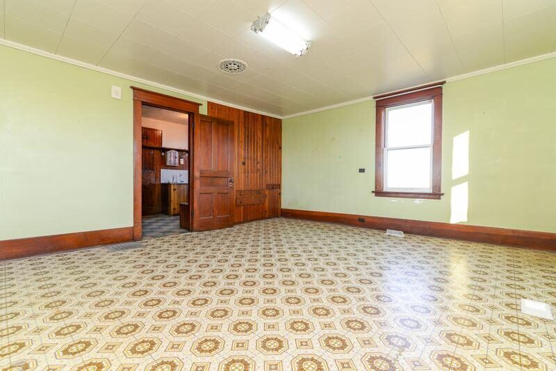Before: original enclosed parlor room with dividing wall