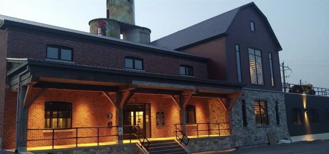 L&A Mutual Insurance, Napanee, brick and stone exterior lit at dusk