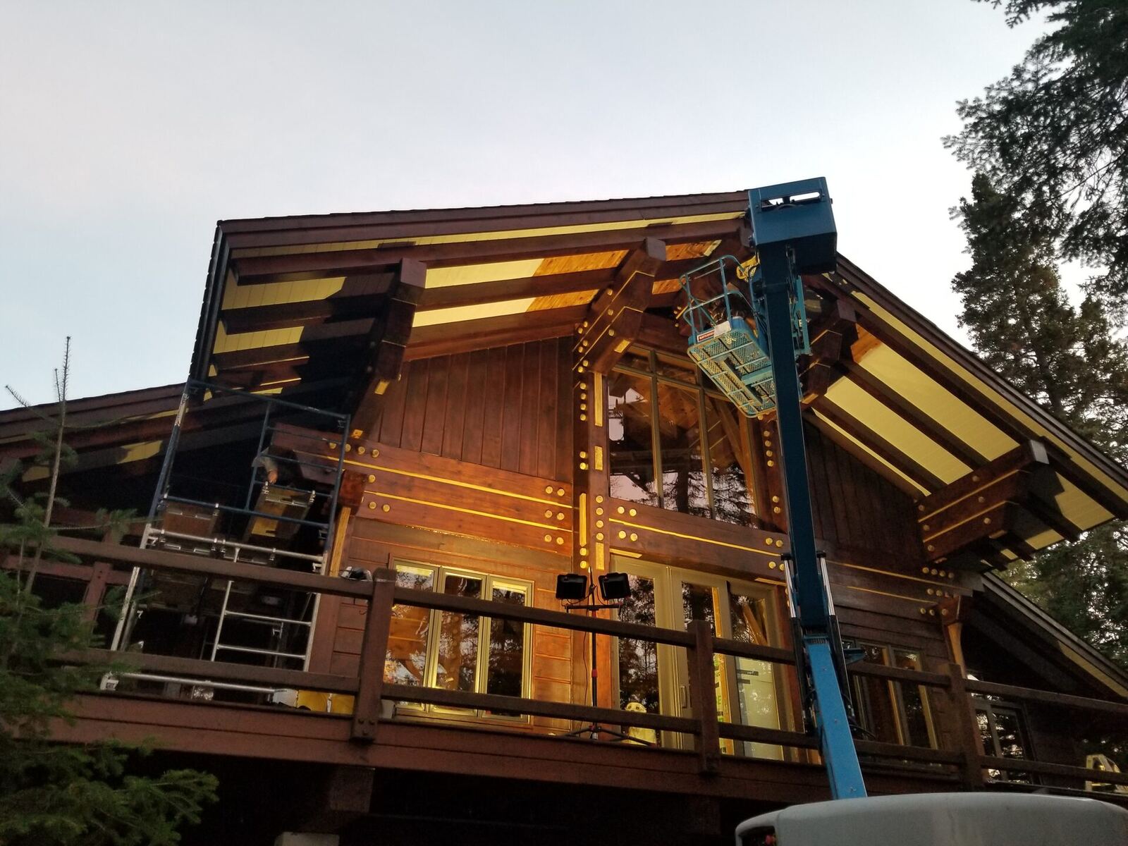 During: lakeside elevation stripped and prepped, scaffolding on the deck