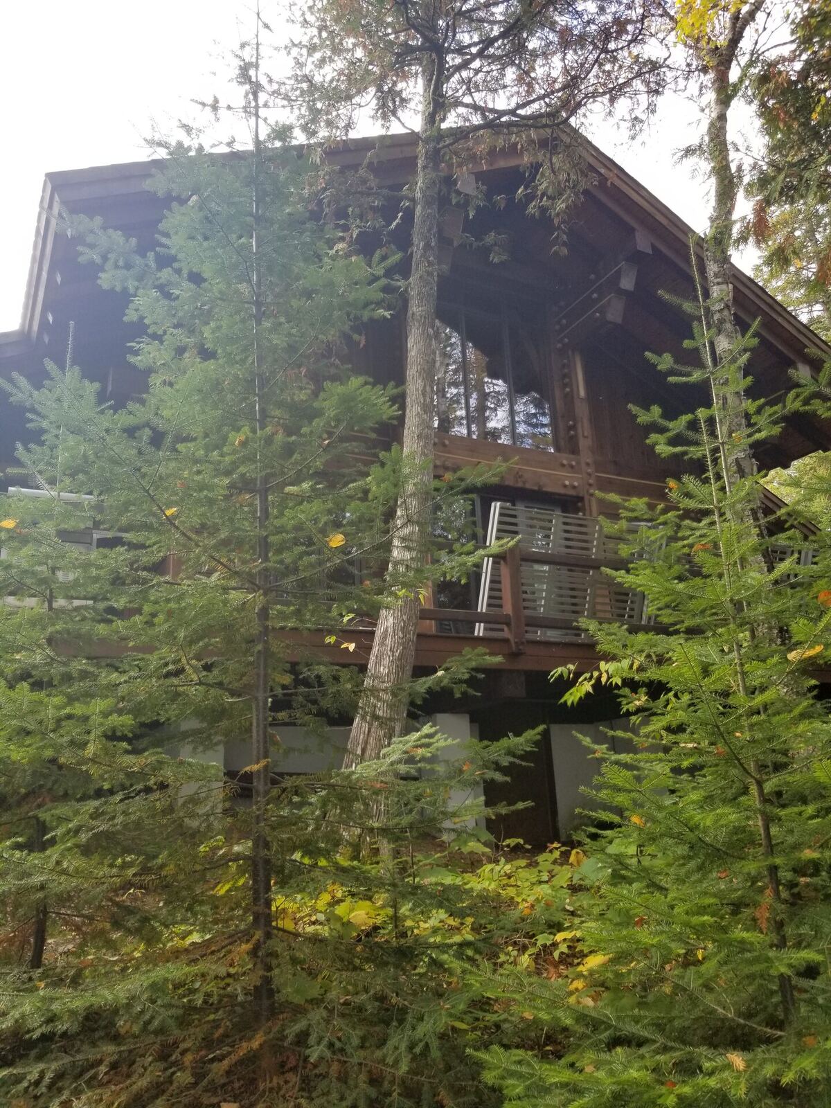 Before: lakeside elevation, original finish, no access road yet