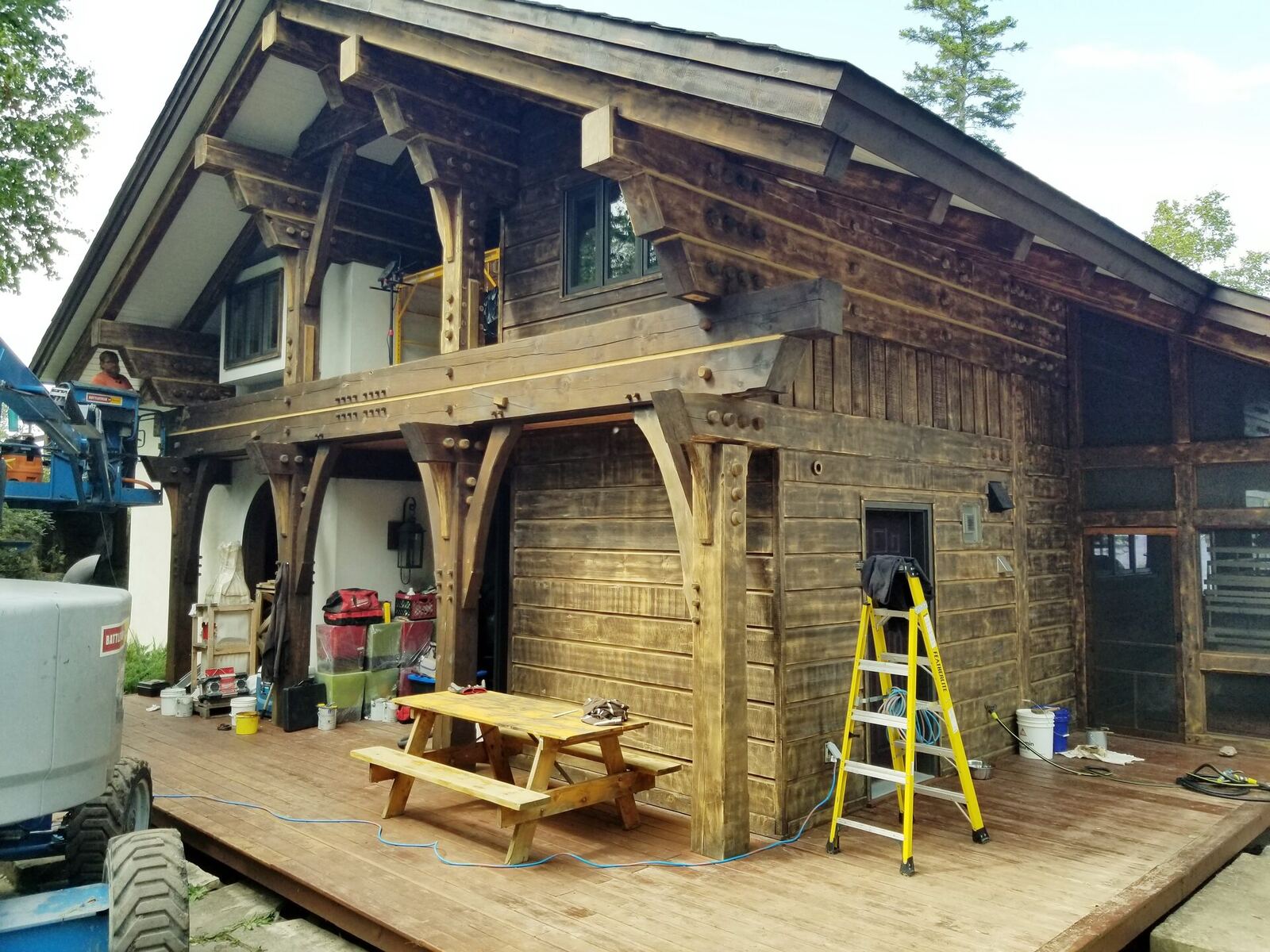 During: lift in place, stain partially applied to front elevation