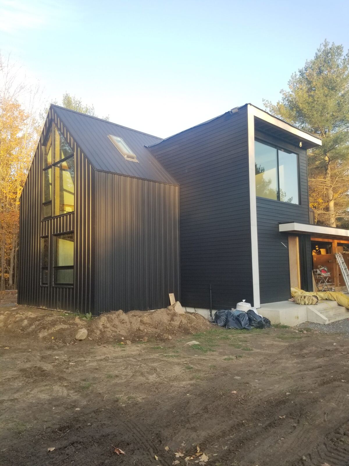 Modern black-clad home exterior, Forest River Group build with Rubio Monocoat interior flooring