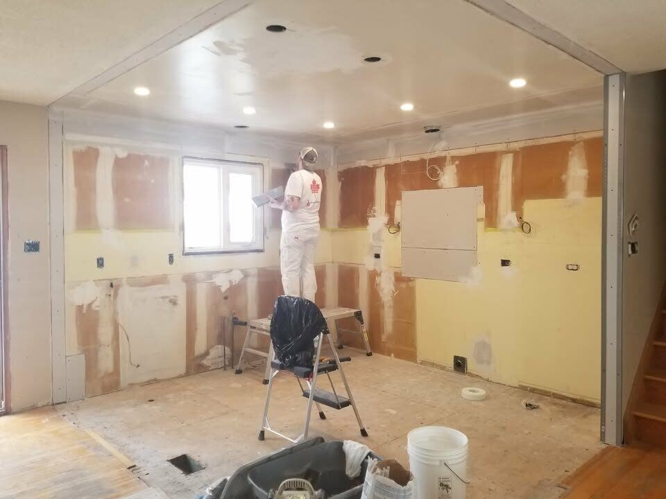 Before: gutted kitchen down to drywall, mid-prep